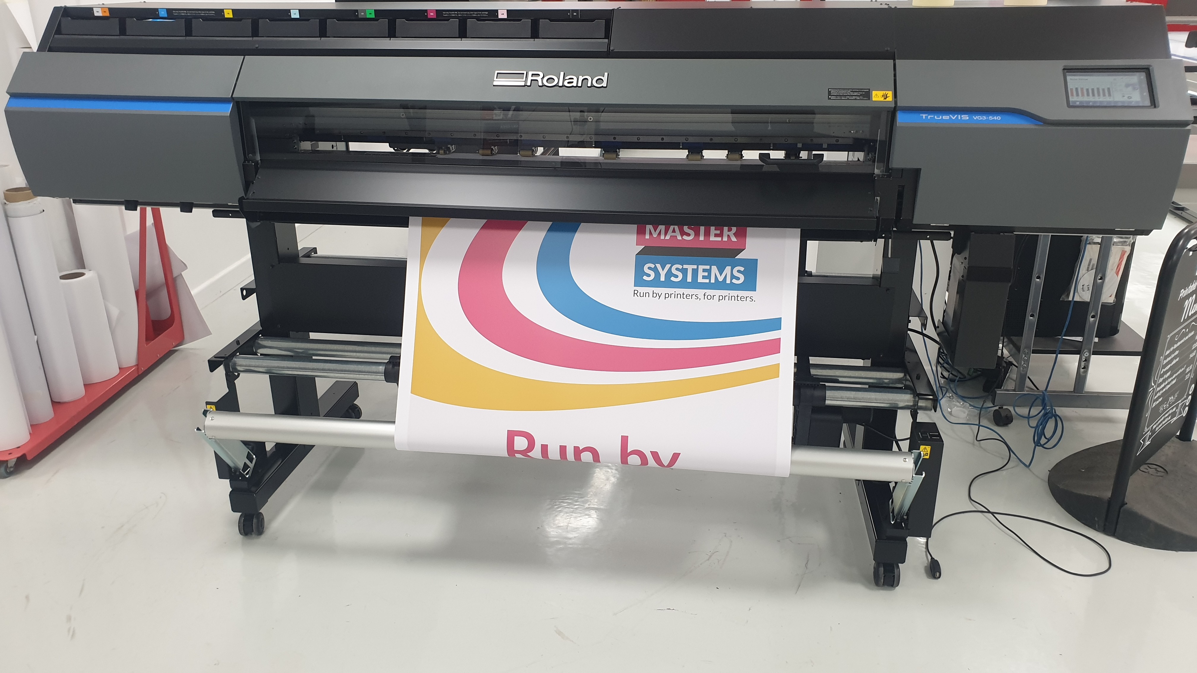 picture of pull up banner material being printed on a wide format printer