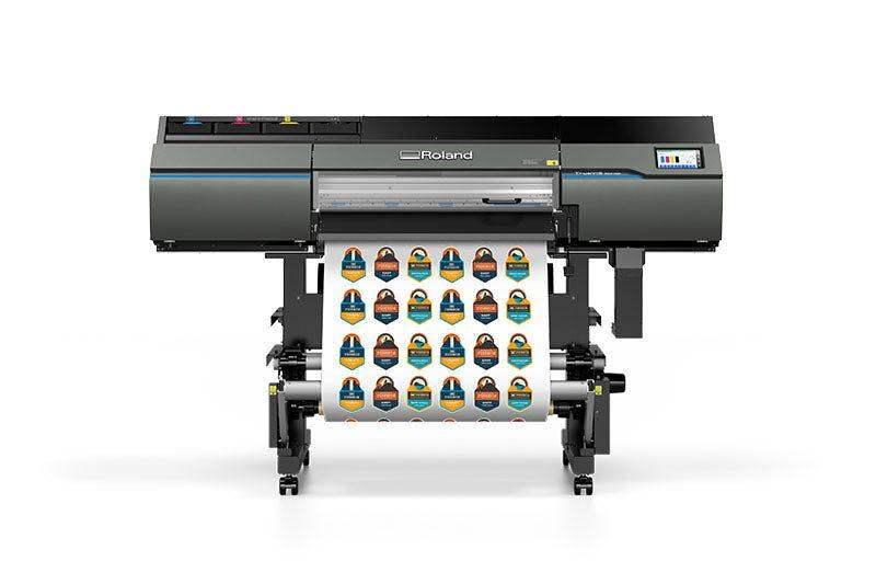 Roland wide-format printer producing multiple vibrant sticker prints, highlighting how the right material choice supports low-cost, high-quality sticker production.