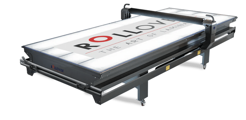 A flatbed application table helping a business consistently apply high quality graphics and vinyls.
