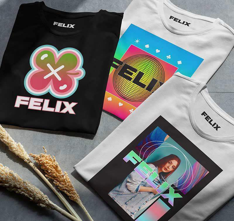 Three custom-printed t-shirts featuring vibrant graphic designs produced using wide format printers. 
