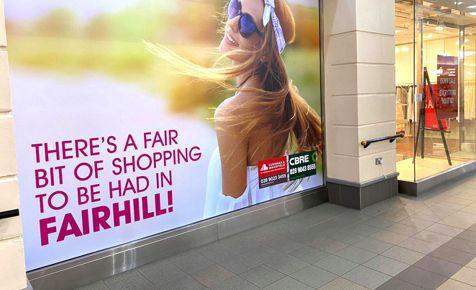A large print media display advertising shopping. 